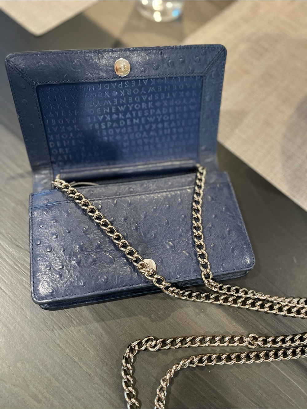 Kate Spade navy leather crossbody with gold logo plate